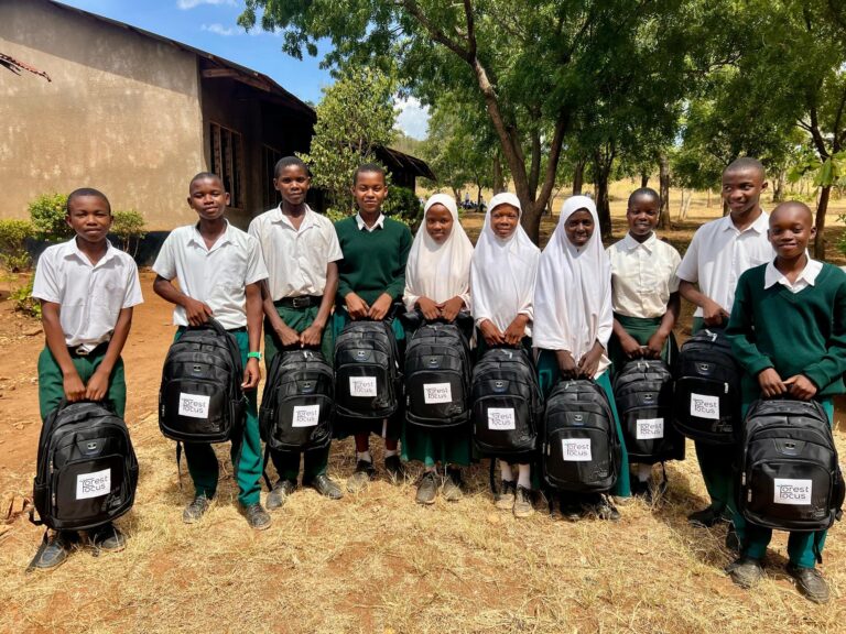 Children after receiving school bags from forest focus